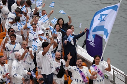 Andrea Murez and Peter Paltchik, flagbearers of Team Israel, on the River Seine during the opening ceremony of the Paris Olympics