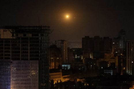 An explosion of a drone is seen in the sky over Kyiv.
