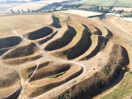 An aerial view of the dried out ground of Maiden Castle Iron Age hillfort in Dorchester.
