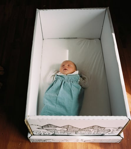 Debbie’s newborn baby asleep in the Scottish baby box, which provides a safe place to sleep and comes full of baby essentials.