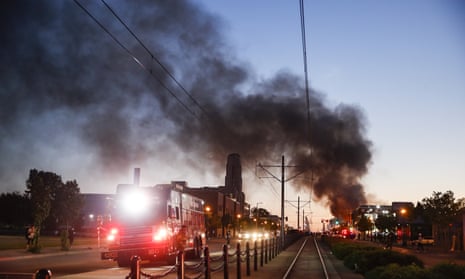 A building burns along University Avenue during a protest, Thursday, May 28, 2020.