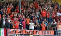 Luton Town supporters applaud their team on 19 May 2024 in Luton, England
