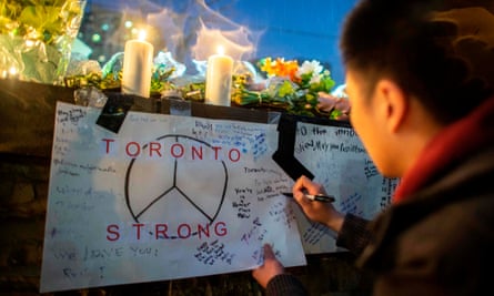 A makeshift shrine near the site in Toronto where Alek Minassian killed 10 people by driving his van on to the pavement.