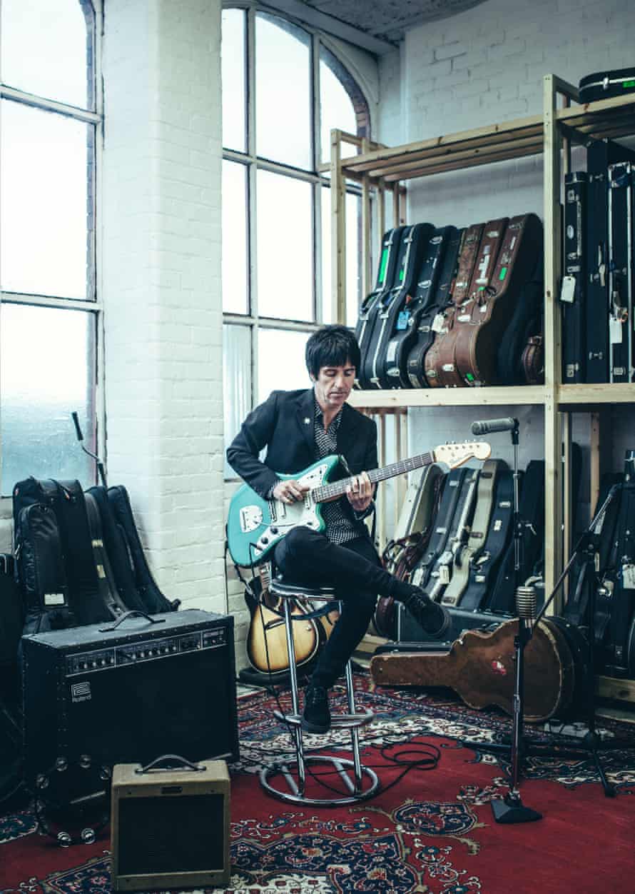 Johnny Marr playing his guitar