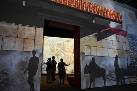Inhabitants of Pompeii walk on the walls of the National Museum of Australia