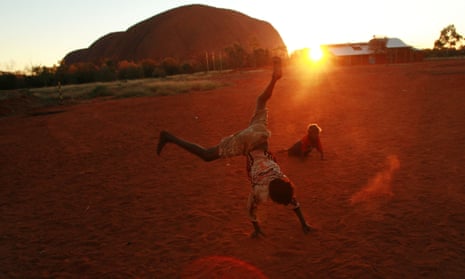 Aboriginal children playing near Uluru