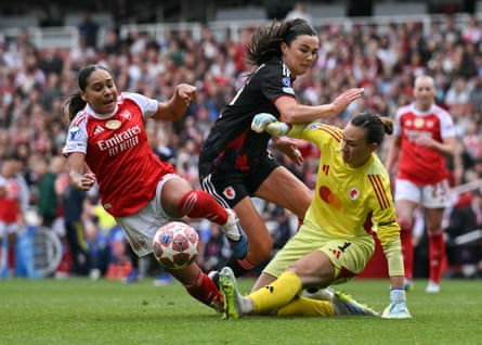 Lyonnes goalkeeper Christiane Endler and Ingrid Syrstad Engen try to fend off Arsenal’s Olivia Smith