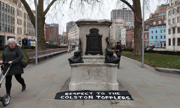 A sign saying “Respect to the Colston topplers” lies at the base of the plinth where the statue of Edward Colston stood before it was removed by protesters.