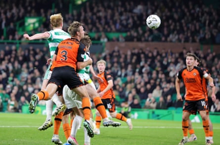 Celtic's Liam Scales jumps to make it 2-2 against Dundee United