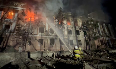 Firefighters work at a site of a building damaged by a Russian missile strike in Mykolaiv, Ukraine.