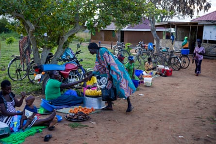Women at a small marketplace in Okere City