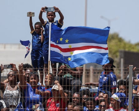 Cape Verde fans assemble with their national flags to welcome the team after they arrive from the United States in Praia, Cape Verde