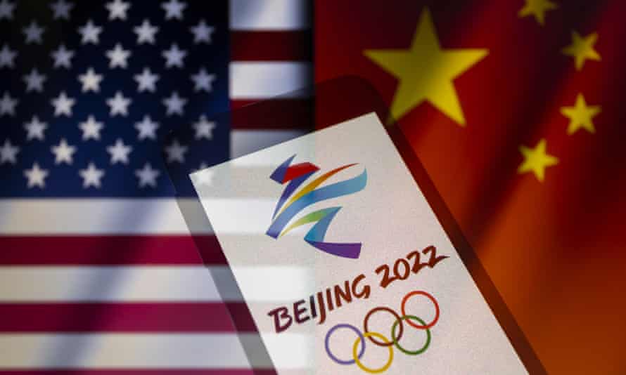 Beijing 2022 Emblem, U.S. and Chinese Flags, Assunsion, Paraguay-December 6, 2021 Required Credits: Photo: Andre M Chang / ZUMA Press Wire / REX / Shutterstock (12633715c) Illustration: Multiple exposure image in camera is U.S.A. The 2022 Winter Olympics on smartphones against the backdrop of China's cut-out waving flags. The XXIV Winter Olympics will be held in Beijing, China, from February 4th to 20th, 2022. 2022 Beijing Emblem, US and Chinese Flags, Asuncion, Paraguay-December 6, 2021