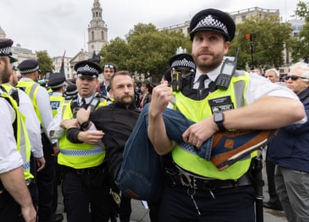 Police move a protester.