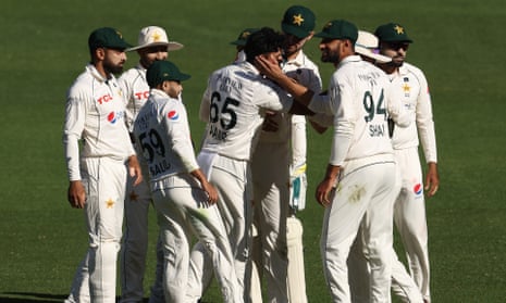 Aamer Jamal celebrates the wicket of Travis Head for 40.