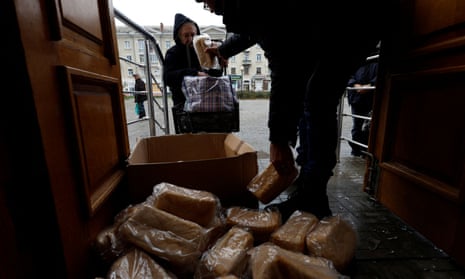 People come from their underground shelters to receive bread, as Russia’s invasion of Ukraine continues, in the eastern Donbas region of Bakhmut, Ukraine, October 30, 2022.