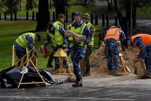 Members of the Australian defence force prepare sandbags for residents in Windsor