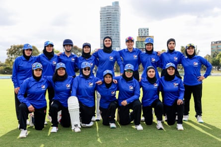 Afghanistan Women’s XI players pose for a team photo during the cricket match between Afghanistan Women’s XI and Cricket Without Borders XI at Junction Oval in Melbourne