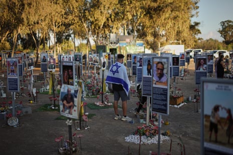 People visit the site of the Nova music festival, as Israel marks the second year anniversary of the deadly Hamas-led attack.