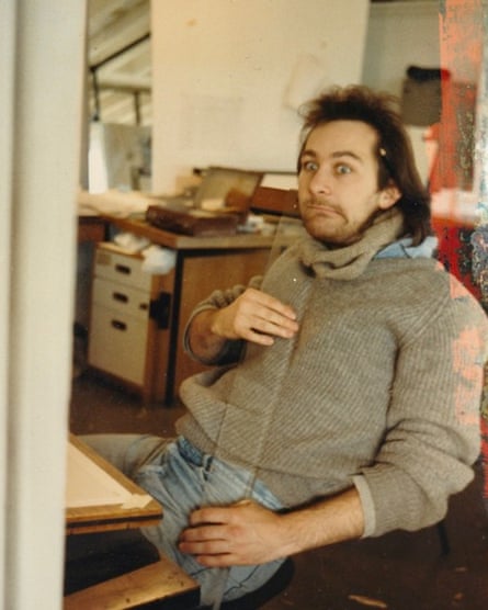 Jonny Clothier in his student days at Bristol, sitting in a chair at a drawing board, pulling a funny face