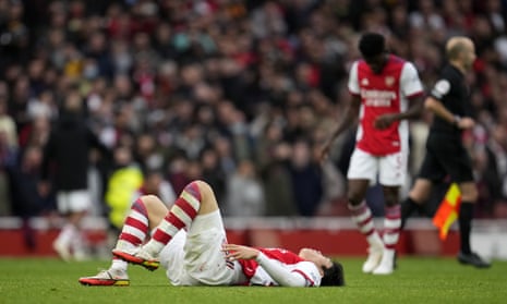 Arsenal’s Takehiro Tomiyasu lies on the pitch after their defeat.