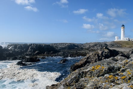 Seafoam around the southern coast of Fair Isle, with the lighthouse in view.