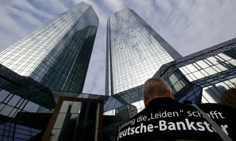 A protester outsider Deutsche Bank HQ in Frankfurt, Germany