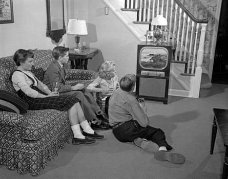 Kids watch TV in black and white 1950s photo