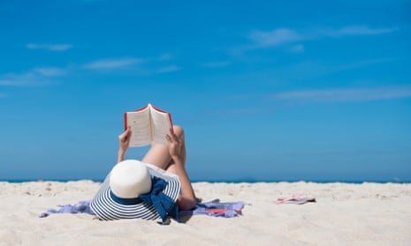 woman reading on beach