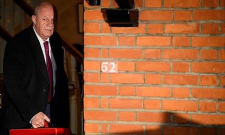 Damian Green by a wall
