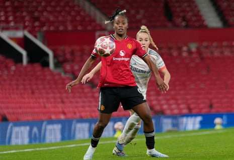 Melvine Malard holds up the ball under pressure from Giulia Gwinn.