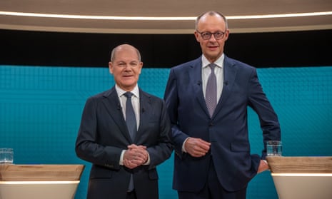 Incumbent German chancellor and Social Democratic party (SPD) leader Olaf Scholz (left) and Christian Democratic Union (CDU) leader Friedrich Merz (right) pose for a picture before their TV debate in Berlin.