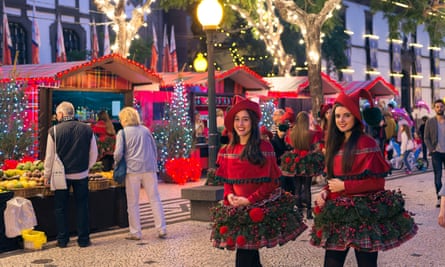 Young women in festive dress at a funchal christmas market