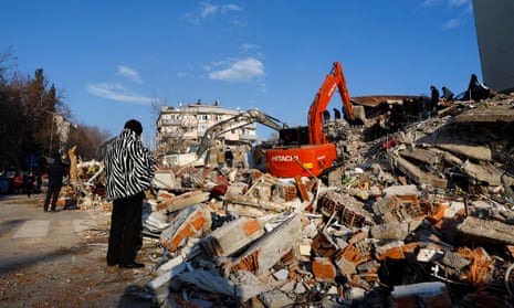 A person looks at rubble and debris following an earthquake in Kahramanmaras, Turkey, 8 February 2023.