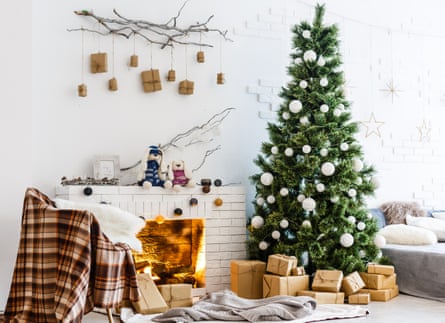 Fireplace and Christmas tree with presents in living room
