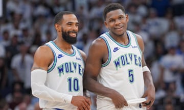 Minnesota Timberwolves guard Mike Conley (10) and guard Anthony Edwards (5) talk during the fourth quarter of Thursday’s game against the Denver Nuggets.