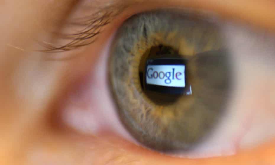 The Google logo reflected in the pupil of a human eye