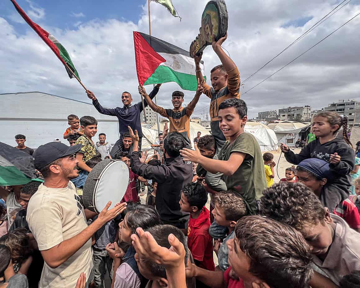 Palestinians celebrate in Nusairat Camp with flags and drums