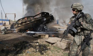 An overturned Bradley fighting vehicle in Baghdad, in May 2007. The vehicle was hit by an IED, killing six American soldiers and a translator.