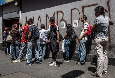 hunger crisis essay People queue to withdraw money from a cash machine in Venezuela