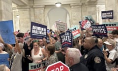 people hold signs in support of and against abortion