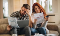 Worried couple looking at bills 