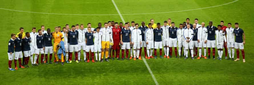 England and France stand together before the friendly at Wembley played shortly after the Paris terrorist attacks last year.
