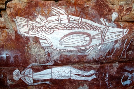 A barramundi and female spirit figure painted in a white pigment called huntite, a scarce mineral mined, traded and highly valued by Bininj.