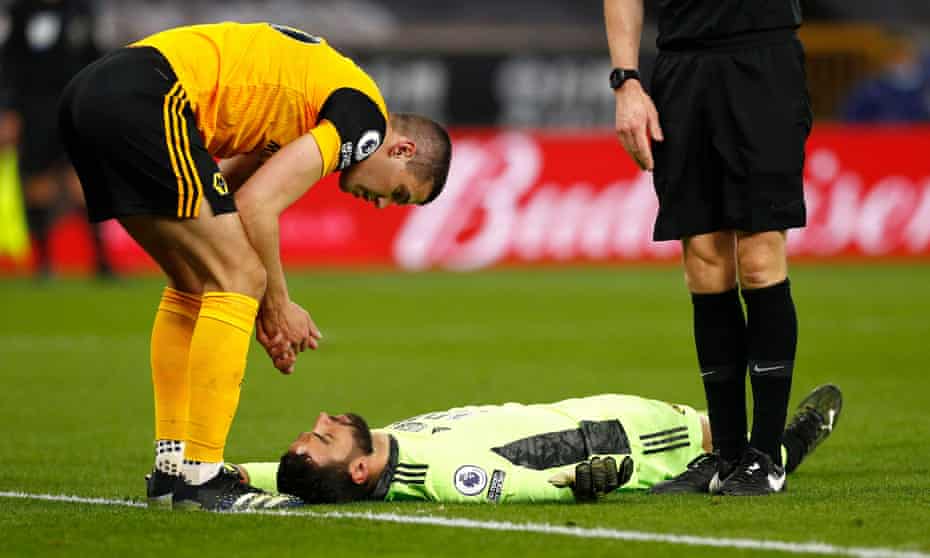Conor Coady looks at Rui Patrício after accidentally injuring his Wolves teammate against Liverpool.