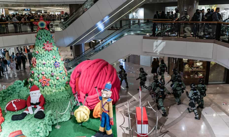 Hong Kong riot police secure an area in shopping mall on Christmas Eve.