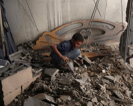A Palestinian boy inspects the site of an overnight Israeli airstrike on a house in Gaza City, on Wednesday, 23 July 2025.