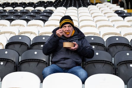 Fan Kelvin Mawer tucks in before kick-off at Hull City.