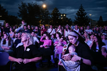 People in the crowd listen to the speeches at Bondi.