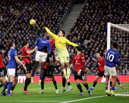 Senne Lammens is first to the ball against Everton